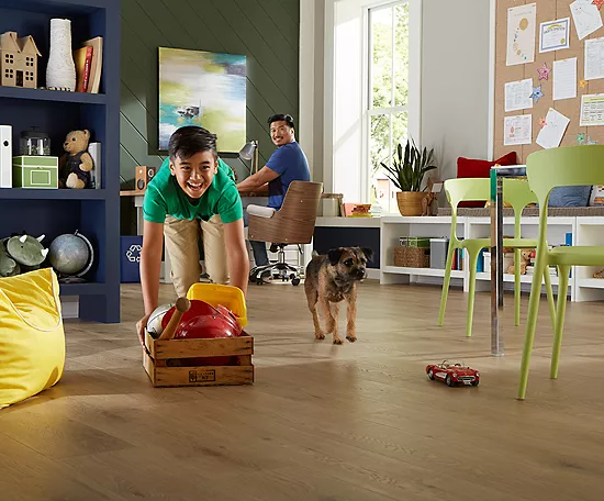 Boy playing with pet | Bowlings Flooring